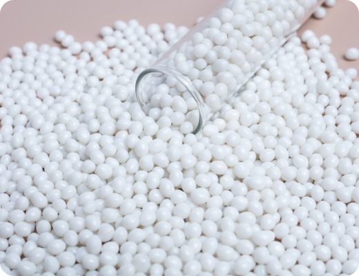 Recycled white plastic pellets, a raw material used in various industries for manufacturing and production.